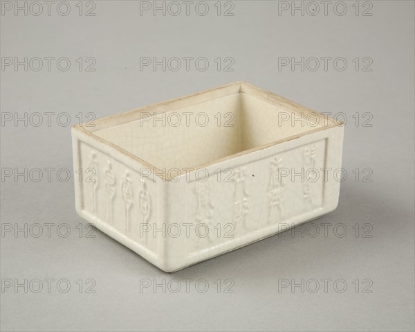 Soft paste rectangular vessel with characters in relief, early 19th century. Artist: Unknown.