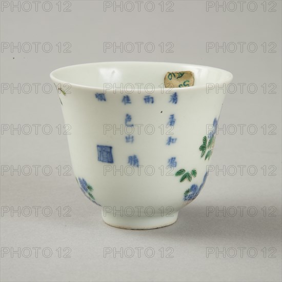 Underglaze blue month cup with polychrome enamelled decoration of a prunus tree. Artist: Unknown.