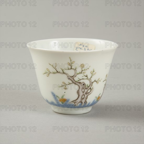 Underglaze blue month cup with polychrome enamelled decoration of a prunus tree. Artist: Unknown.