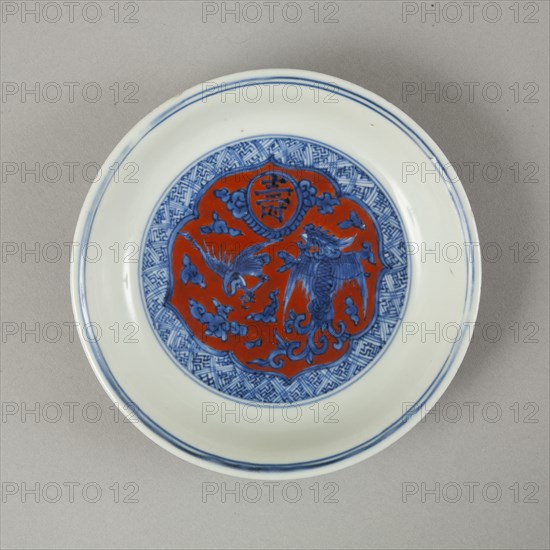 Red clobbered blue and white saucer with stork, phoenix and dragons, Jiajing (1522-1566). Artist: Unknown.