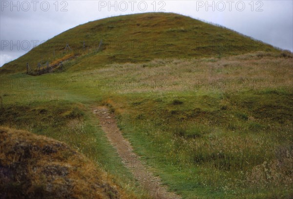 Burial cairn at Maes Howe, Orkney, Scotland, 20th century. Artist: CM Dixon.