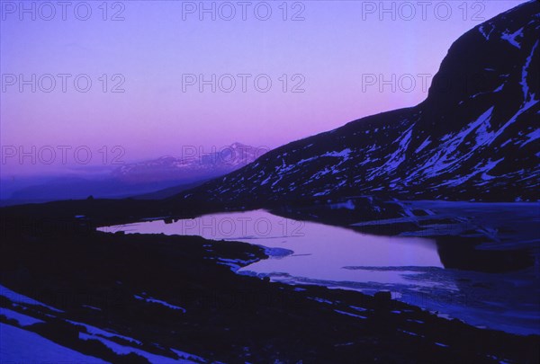 Scotland, Ross-Shire. Sunset at Loch Toll  An Lochain below An Teallach, April. Artist: CM Dixon.