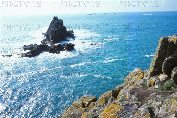 Longships Lighthouse and the Armed Knight, Lands End, Cornwall, 20th century.  Artist: CM Dixon.