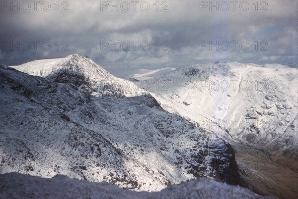 Scafell and Scafell Pike in Winter, English Lake District, Cumbria, 20th century. Artist: CM Dixon.