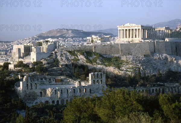 Acropolis and Theatre of Herodes Atticus, Athens from Philopappos Hill at dusk, c20th century. Artist: Unknown.