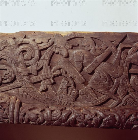 Sigurd kills the Dragon, Fafnir. Detail of wood panel of Hylestad Church, Norway.  Artist: Unknown.