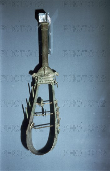 Bronze arched sistrum with Hathor head decoration, late Period, after 600BC. Artist: Unknown.