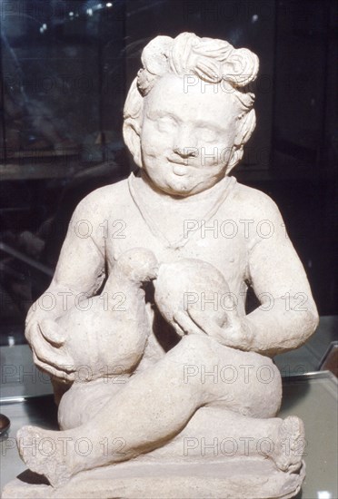 Terracotta Etruscan Votive of Child Feeding Bird, from Vulci, c2nd century BC. Artist: Unknown.