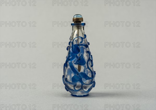 Clear glass snuff bottle with blue overlay, China, Qing dynasty, 1644-1911. Creator: Unknown.