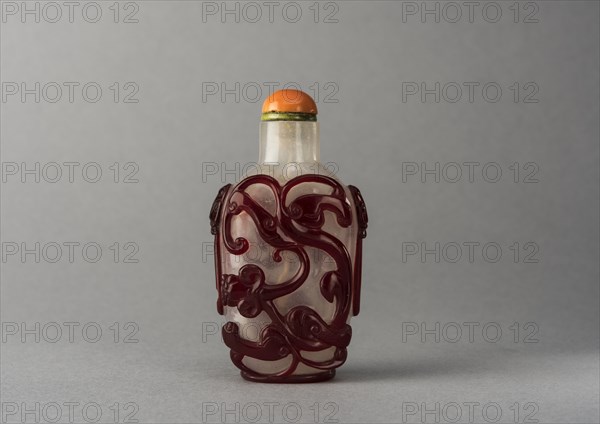 Clear glass snuff bottle with red overlay, China, Qing dynasty, 1644-1911. Creator: Unknown.