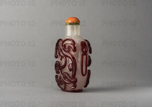 Clear glass snuff bottle with red overlay, China, Qing dynasty, 1644-1911. Creator: Unknown.