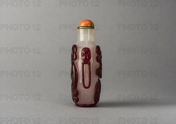 Clear glass snuff bottle with red overlay, China, Qing dynasty, 1644-1911. Creator: Unknown.