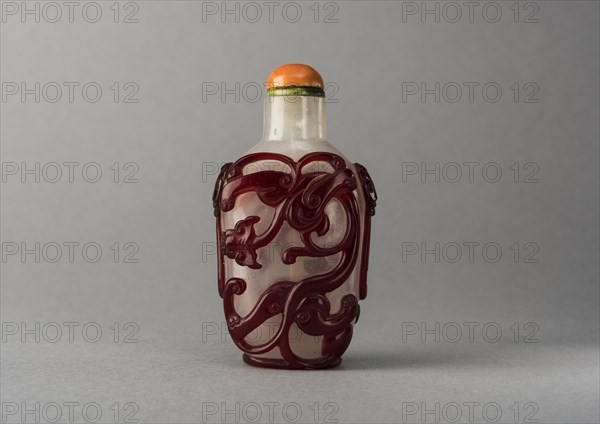 Clear glass snuff bottle with red overlay, China, Qing dynasty, 1644-1911. Creator: Unknown.