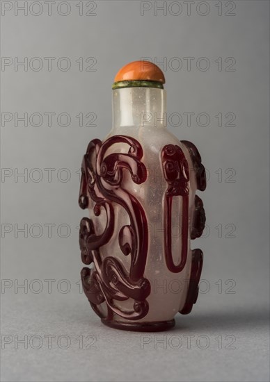 Clear glass snuff bottle with red overlay, China, Qing dynasty, 1644-1911. Creator: Unknown.