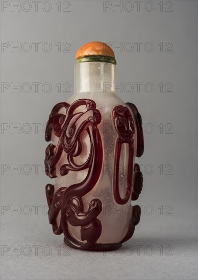 Clear glass snuff bottle with red overlay, China, Qing dynasty, 1644-1911. Creator: Unknown.