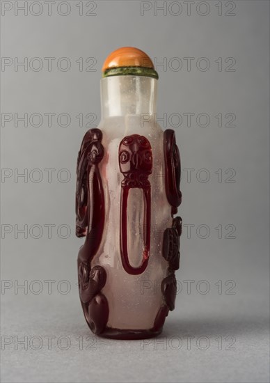 Clear glass snuff bottle with red overlay, China, Qing dynasty, 1644-1911. Creator: Unknown.