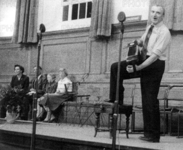 Bob Roberts playing the melodion, Cecil Sharp House, London, October 1957. Artist: Eddis Thomas