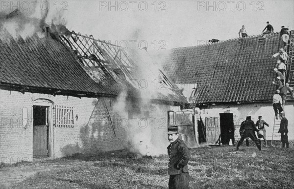 French soldiers fight a fire started by German incendiary bombs, Artois, World War I, 1915. Artist: Unknown