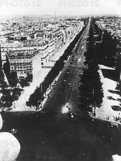 German forces parading along the Champs Elysees, Paris, 14 June 1940. Artist: Unknown