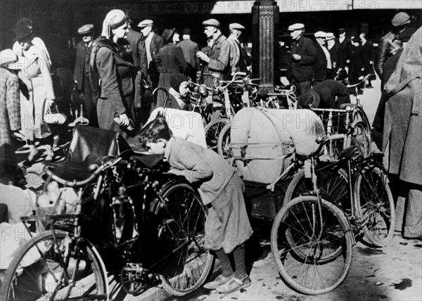 Belgian refugees with their bicycles and possessions outside the Gare du Nord, Paris, July 1940. Artist: Unknown