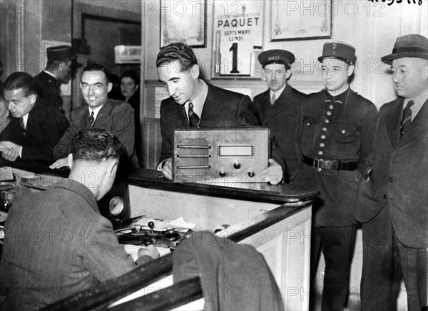 French Jews forced to hand in their radio sets to the police, occupied Paris, September 1941. Artist: Unknown