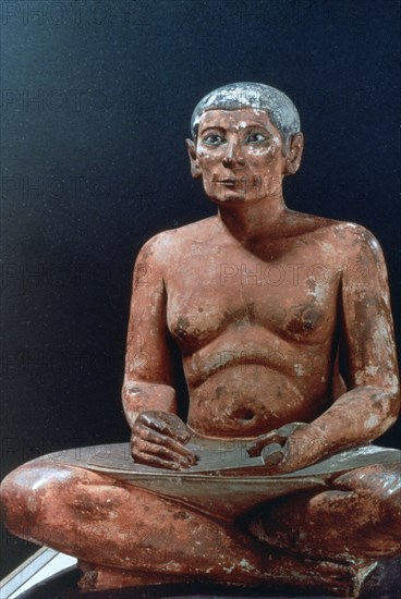 Ancient Egyptian figure of a seated scribe, 25th-24th century BC. Artist: Unknown