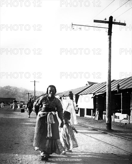 Father and child, Seoul, Korea, 1900. Artist: Unknown