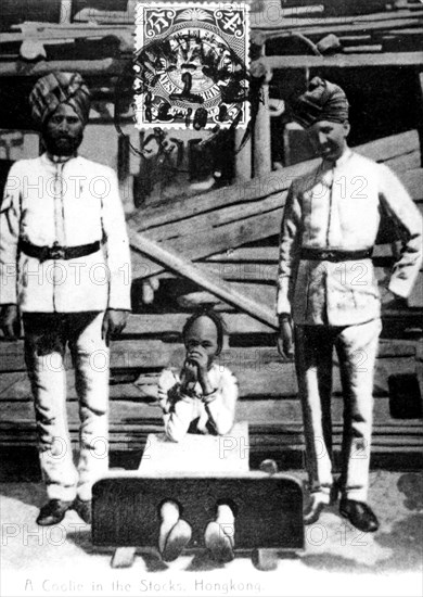 A coolie in the stocks, Hong Kong, 1908. Artist: Unknown