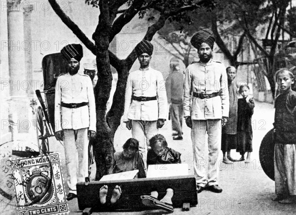 Children in the stocks, Hong Kong, 1908. Artist: Unknown