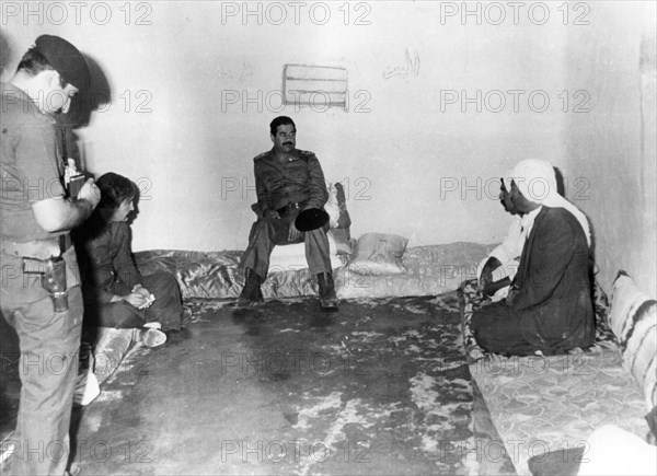 Saddam Hussein visiting a peasant house in Basra, Iraq, 1987. Artist: Unknown