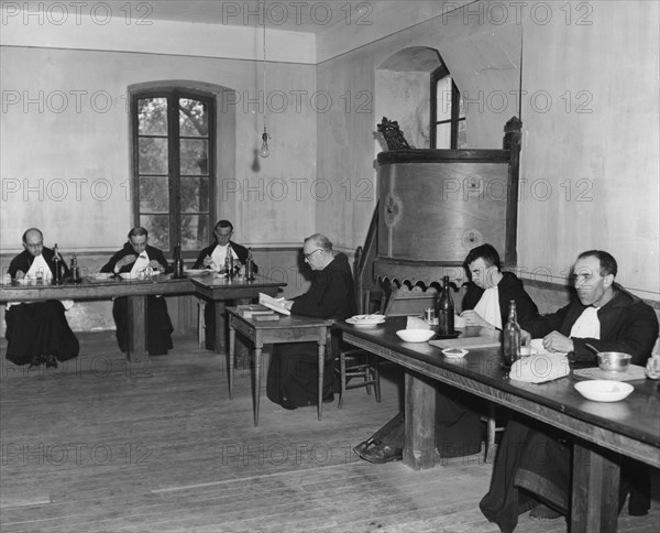 Monks at dinner in the refectory, Asile St Leon, France, c1947-1951. Artist: Unknown