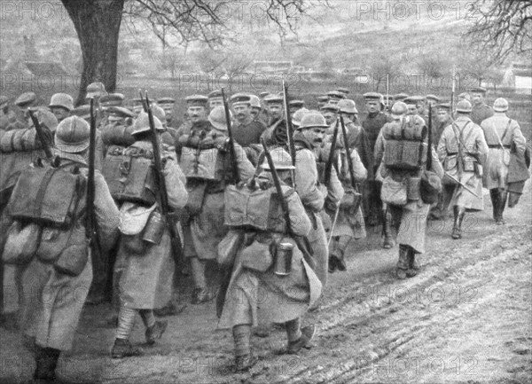 Relief French infantry passing a line of prisoners, Plessis-de-Roye, Picardy, France, 30 March 1918. Artist: Unknown