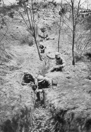 Fench sappers in gas masks re-laying telephone lines after a bombardment, 1918. Artist: Unknown