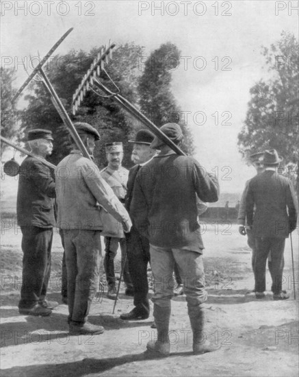 Georges Clemenceau talking with farmers near the front, Chemin des Dames, France, 1918. Artist: Unknown