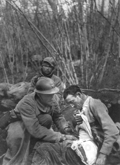 A French soldier's wounds are treated, World War I, France, 1916. Artist: Unknown