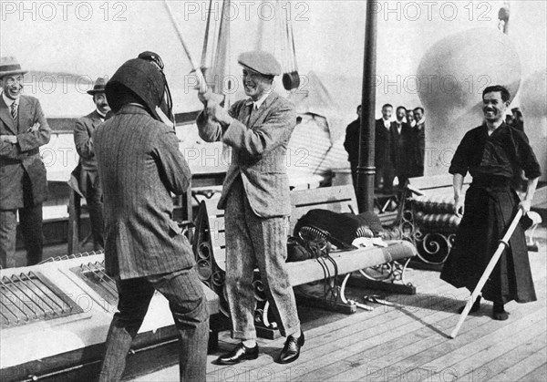 The Prince of Wales testing a Japanese fencing helmet, Japan, 1922. Artist: Unknown