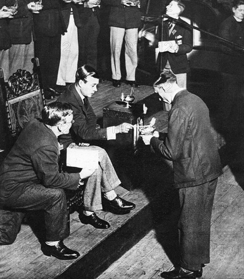 King Edward VIII as the patron of TOC H lighting lamps of remembrance, Westminster, 1936. Artist: Unknown