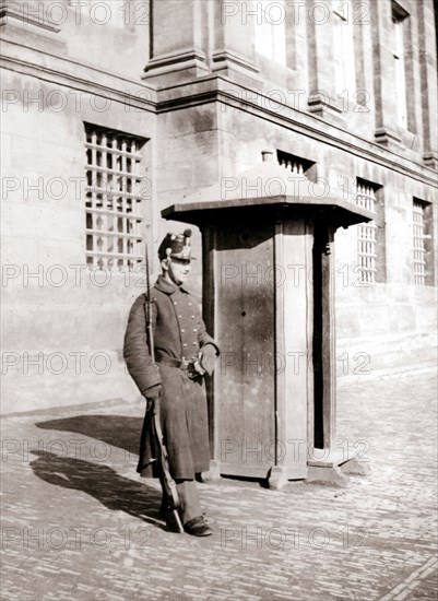 Guard, Brussels, 1898.Artist: James Batkin