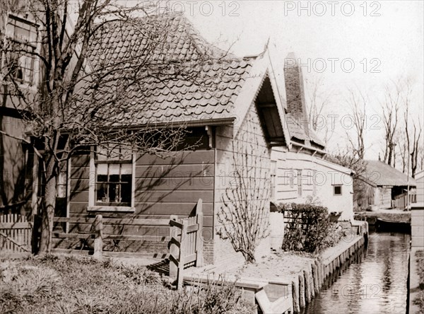 House on a canal bank, Broek, Netherlands, 1898.Artist: James Batkin