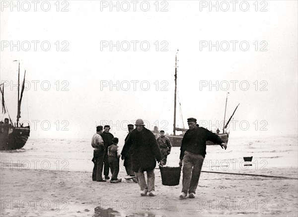 Men on the shore, Scheveningen, Netherlands, 1898.Artist: James Batkin