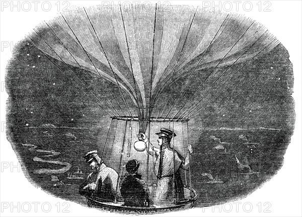 The Nassau balloon passing over Liege at night, 1836, (1886). Artist: Unknown