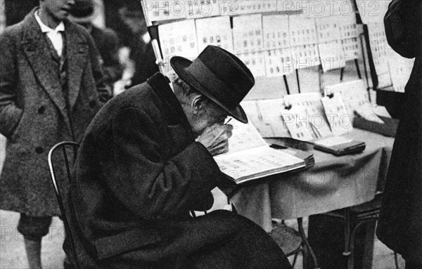 An old purchaser of stamps, Paris, 1931.Artist: Ernest Flammarion