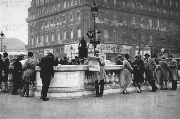 Meeting place at the entrance to a Metro station, Paris, 1931. Artist: Ernest Flammarion