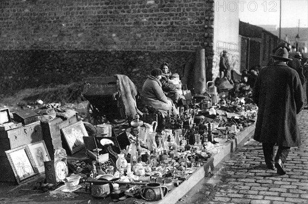 A display of goods at the flea market, Paris, 1931. Artist: Ernest Flammarion