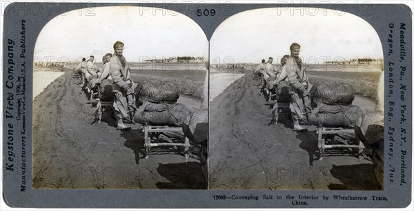 Conveying salt to the interior by wheelbarrow train, China, 1906. Artist: Keystone