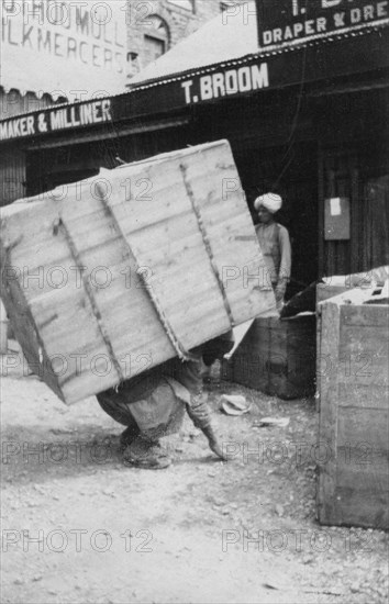 A porter lifting a large load, Chakrata, India, 1917. Artist: Unknown
