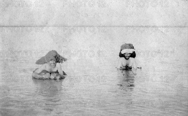 Crossing the Tigris river on inflated goat skins, 1918. Artist: Unknown