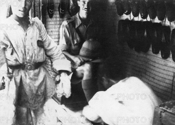 A British officer in a shoe shop, Baghdad, Mesopotamia, WWI, 1918. Artist: Unknown