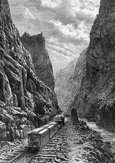 A train passing through the Rocky Mountains, USA, 19th century.Artist: Taylor