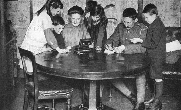 Children emptying their money boxes to invest in war bonds, 1936. Artist: Unknown